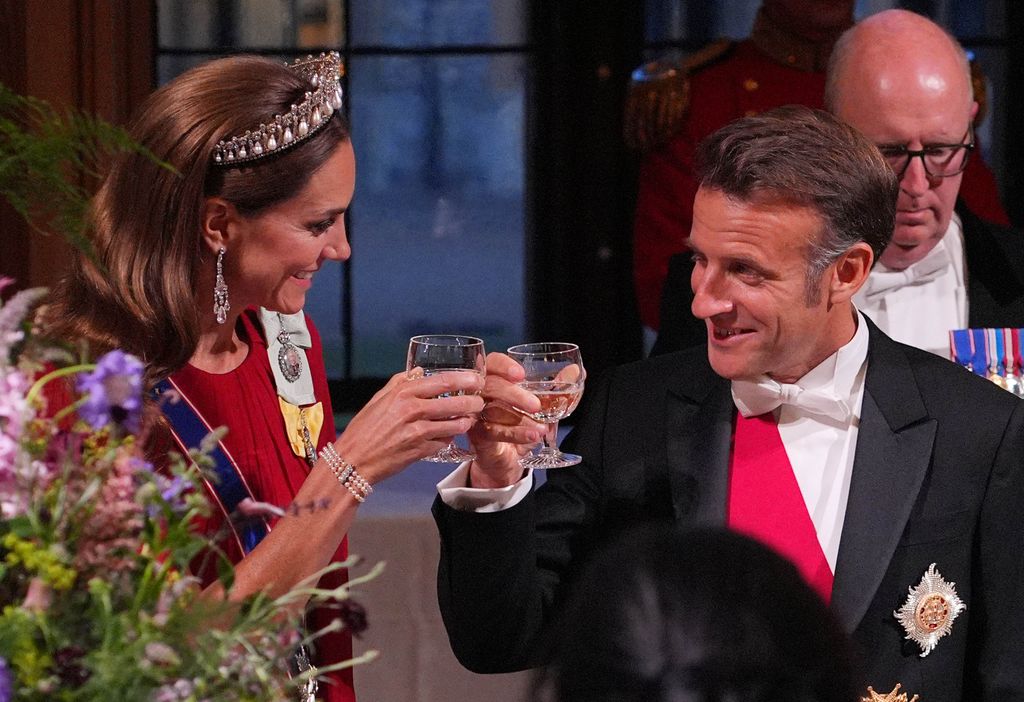 Kate Middleton clinking glasses with Emmanuel Macron