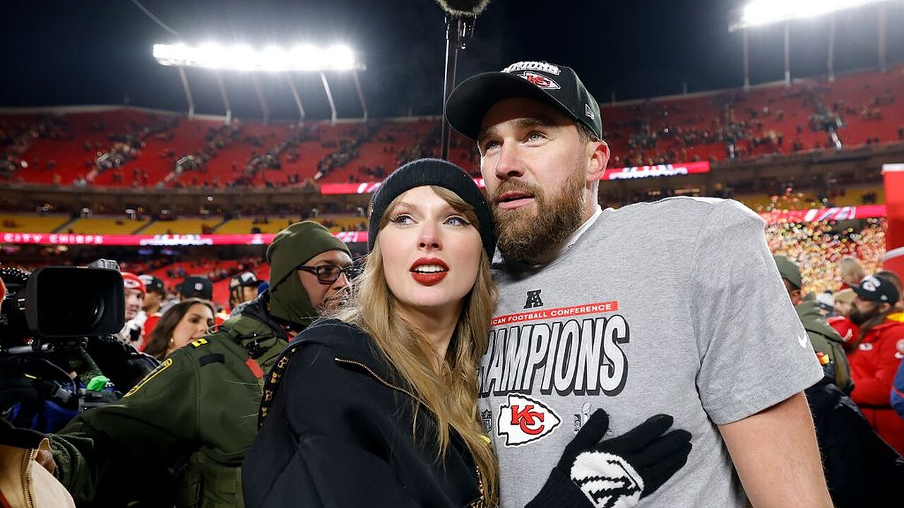 Taylor Swift celebrates with Travis Kelce #87 of the Kansas City Chiefs after defeating the Buffalo Bills