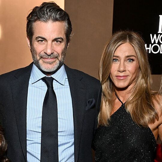 Jim Curtis and Jennifer Aniston, wearing Ralph Lauren, attend ELLE's 2025 Women in Hollywood Celebration presented by Ralph Lauren and Bvlgari with support from evian, Hendrick's Gin, and Lucid Motors on November 17, 2025 in Los Angeles, California
