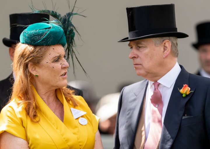 Andrew in top hat and Sarah Ferguson in yellow dress talking to eachother