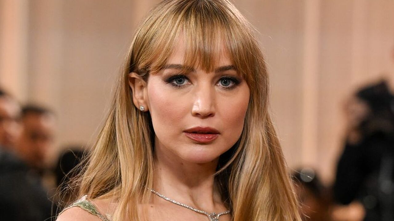 Jennifer Lawrence waist up in sheer floral dress