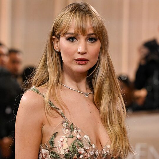 Jennifer Lawrence waist up in sheer floral dress
